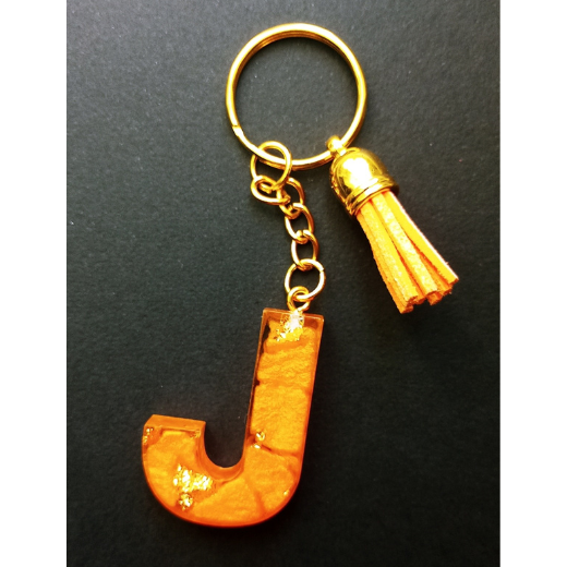 Atslēgu Piekariņš "J" - oranžs