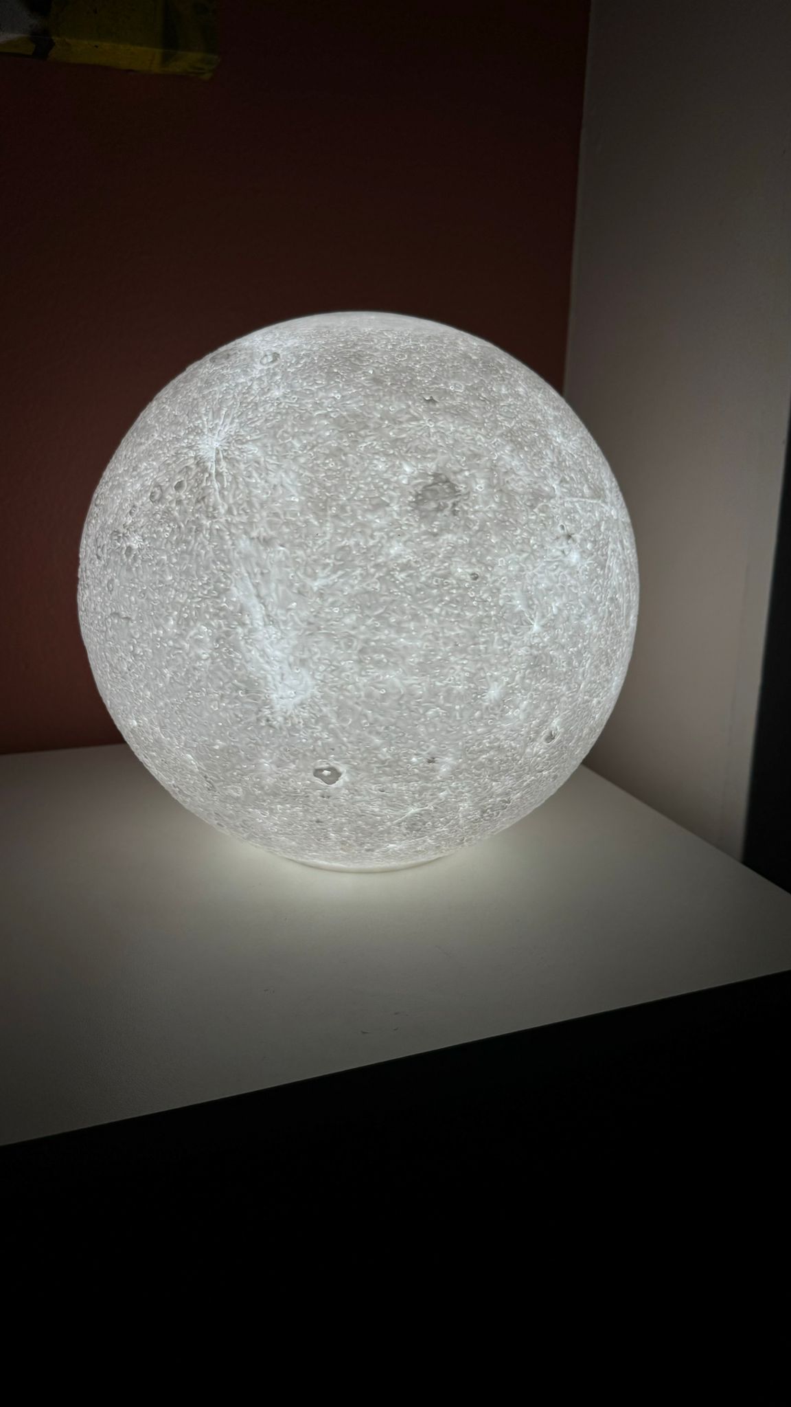 Close-up of 3D printed moon night light surface detail.